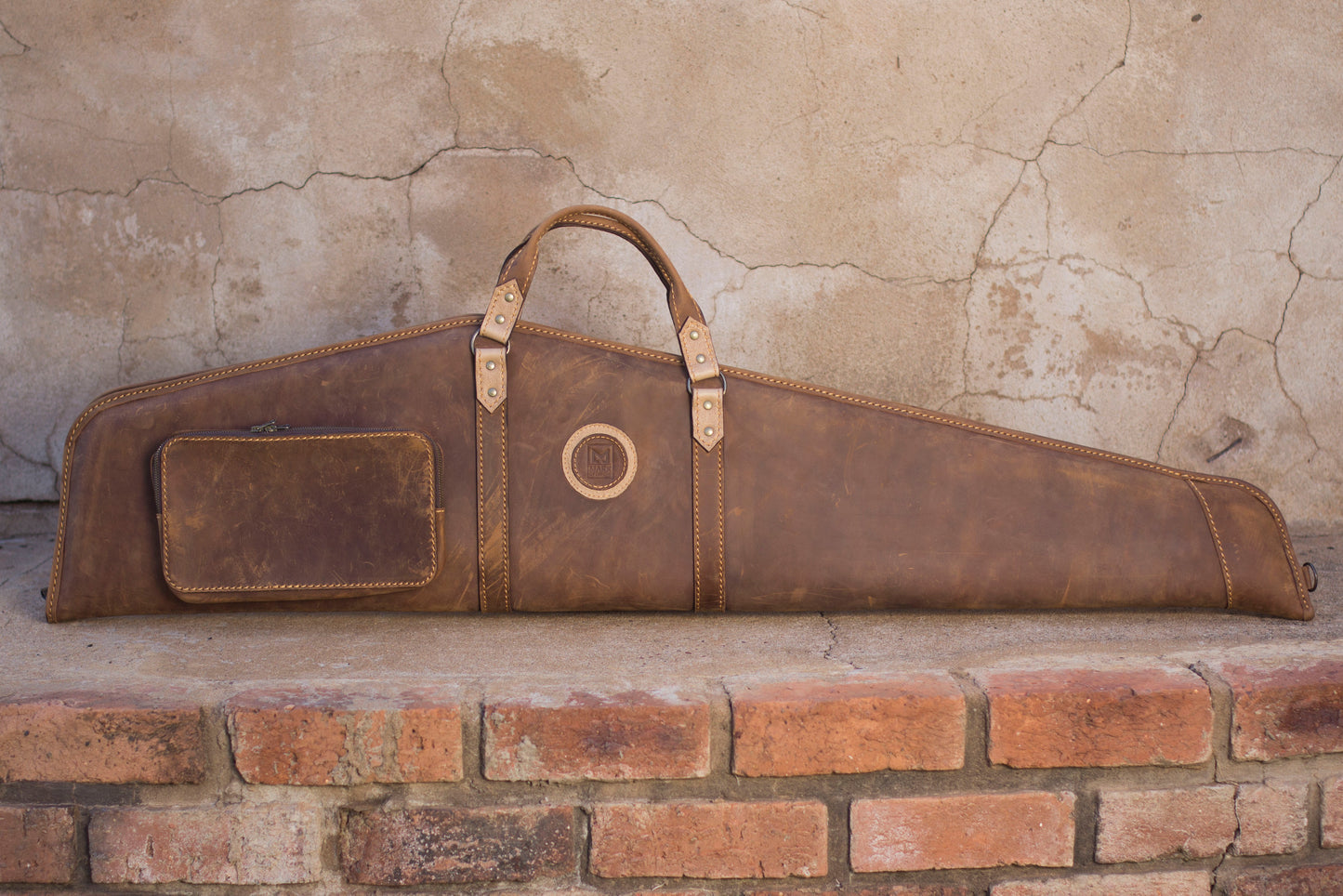 Premium full-grain leather rifle bag by Mark of Legend, available from Yisipho in Salvador Choc and Zebra/Oxblood.